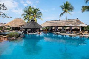 Tropical beach vacation resort with pool and swim up bar - Edgewood Travel