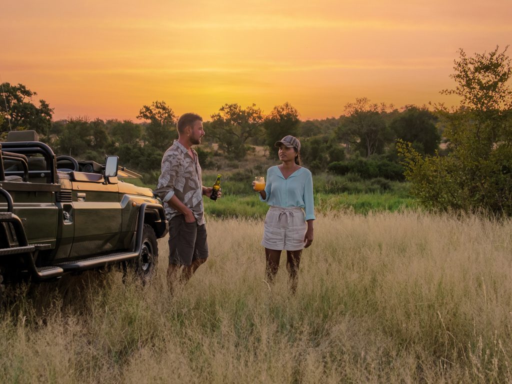 Asian women and European men on safari game drive in South Africa Kruger national park - Edgewood Travel
