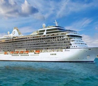 Image for Oceania Cruises' Riviera ship sailing on calm waters under a partly cloudy sky